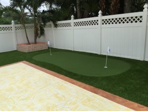 Artificial grass installed in a Miami backyard to be used as a putting green