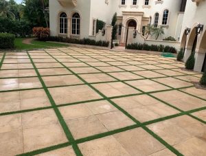 Artificial grass installed in the drive way of a Pompano Beach home 